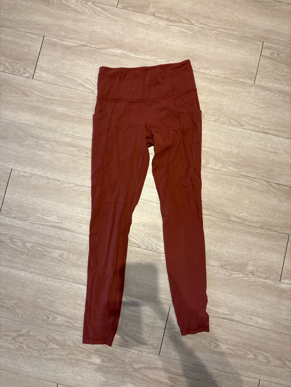 Athleta Stash Pocket Salutation Tight in Rust